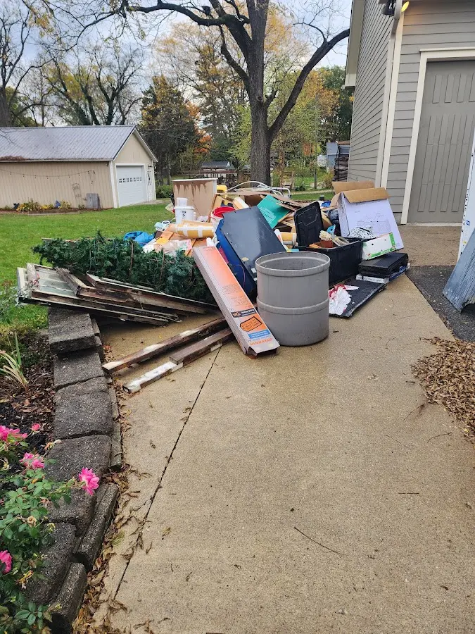 Dumpster being loaded with debris for 30 Yard Dumpster Rental in Warrensburg